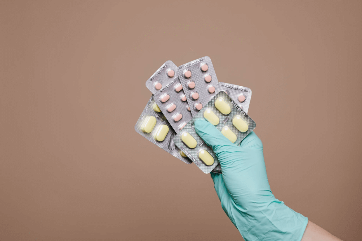 person holding medicines