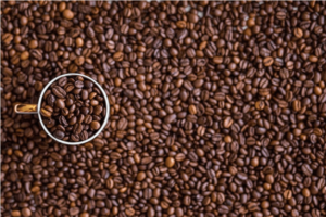 white-mug-containing-coffee-beans