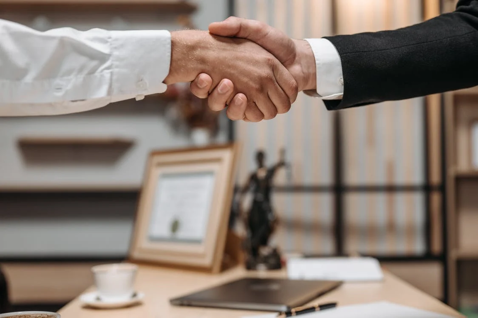 Two men shaking hands.