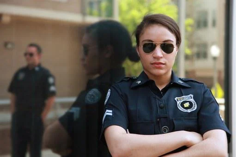 Woman in security clothes and accessories.