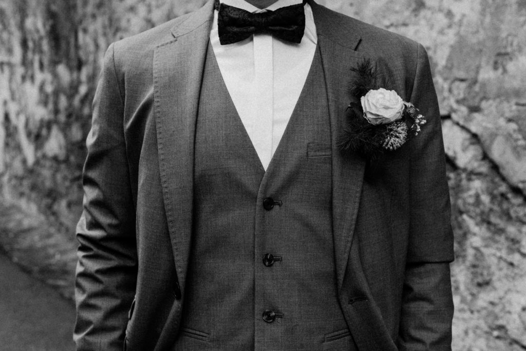 A man dressed up in a Tuxedo-style suit.