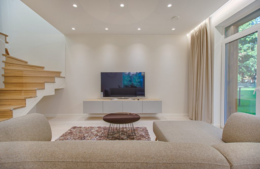 A beautiful colorful TV placed on a TV unit.