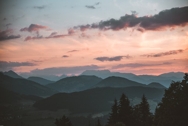 The smoky mountains and the orange sky.