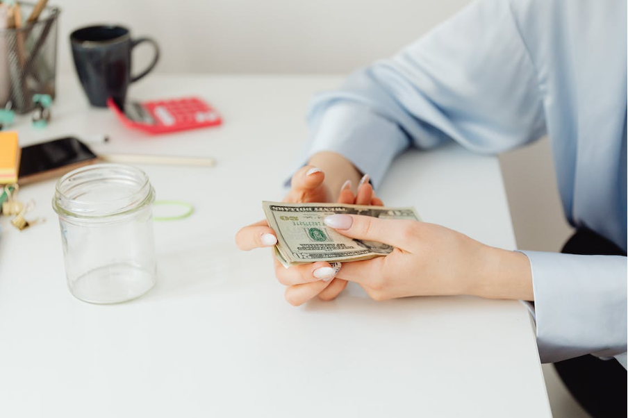 A man holding money in his hand.