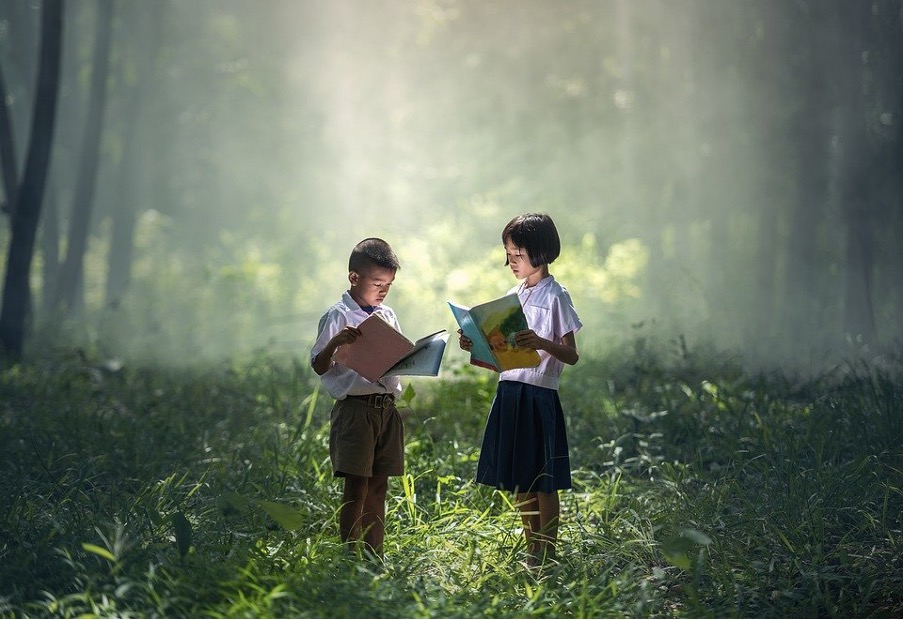 A boy and a girl studying.